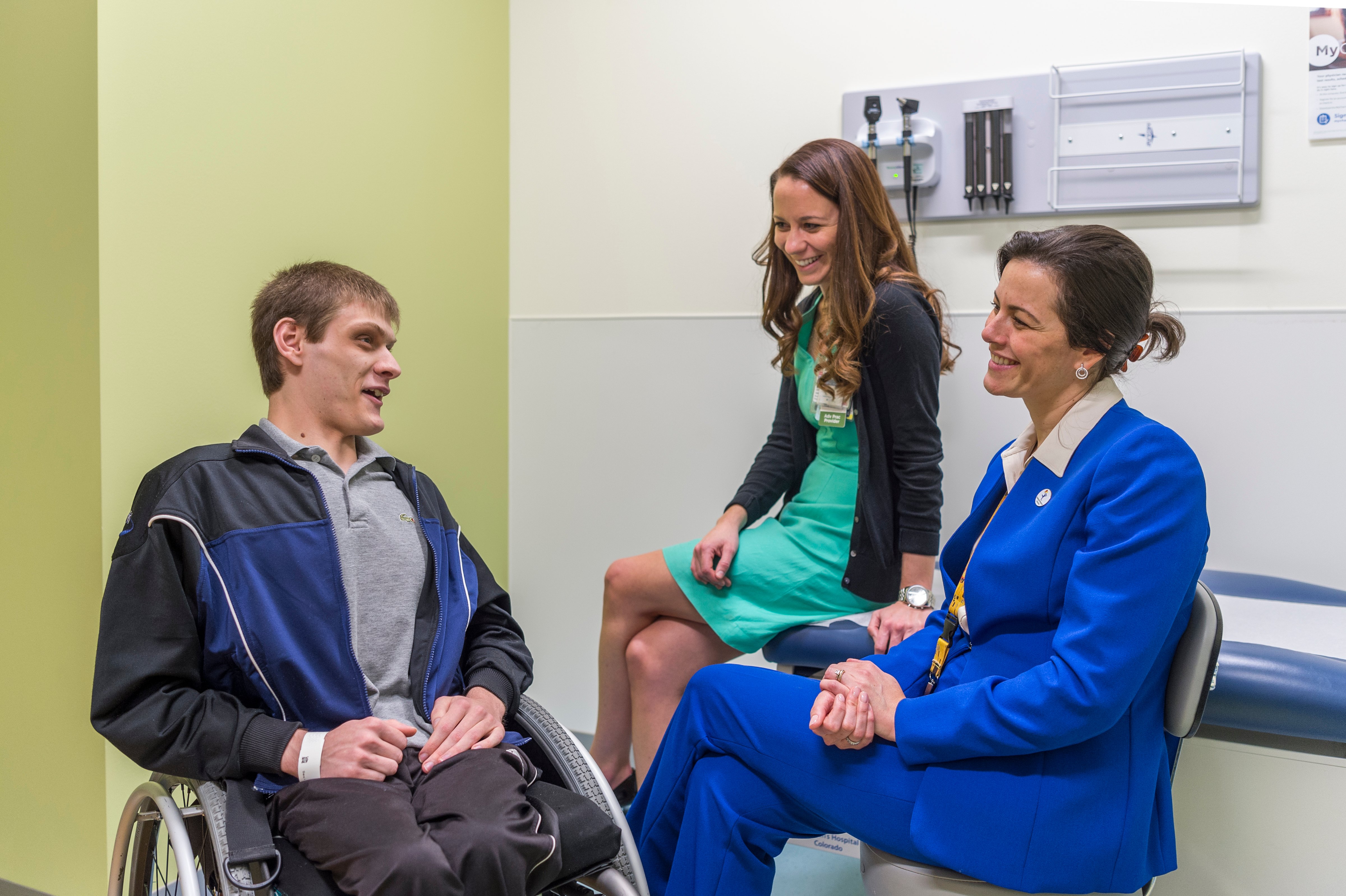 Jonathan Mackey in exam room with Dr. Andrea Bischoff and Julie Schlekter, nurse practitioner