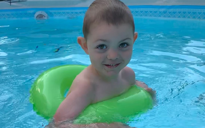 Noah seen here swimming – something his family wasn’t sure he’d be able to ever do.