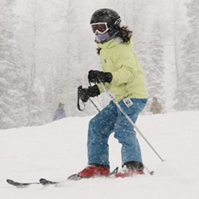 Children's Hospital Colorado cerebral palsy patient Paige skis on a mountain.