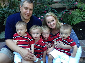 The Cambruzzi family of mom, dad and four boys in matching red, black and white striped polos tell their story of twin-to-twin transfusion syndrome.