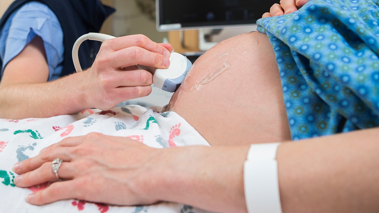 Using an ultrasound on a pregnant patient