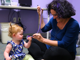 Dr. Nicole Tartaglia meets with a young patient.