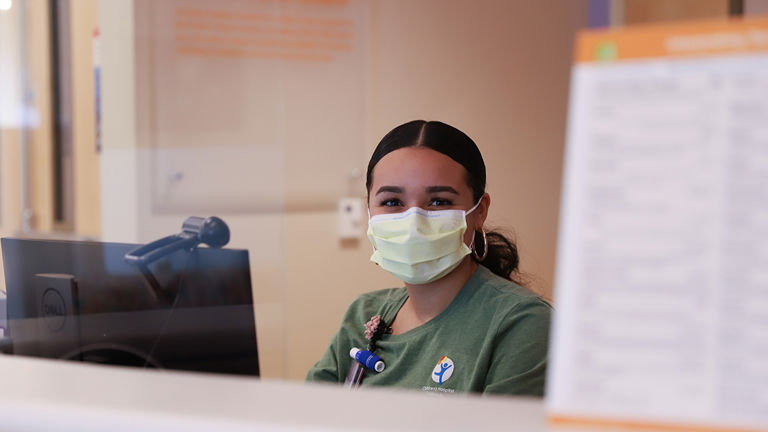 Children's Hospital Nurse smiling with a mask on