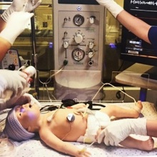 The EMS team at Children's Hospital Colorado practices on a computerized mannequin baby.