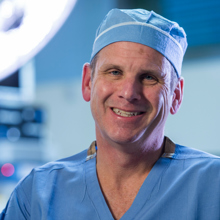 Dr. James Jaggers is shown in operation room scrubs