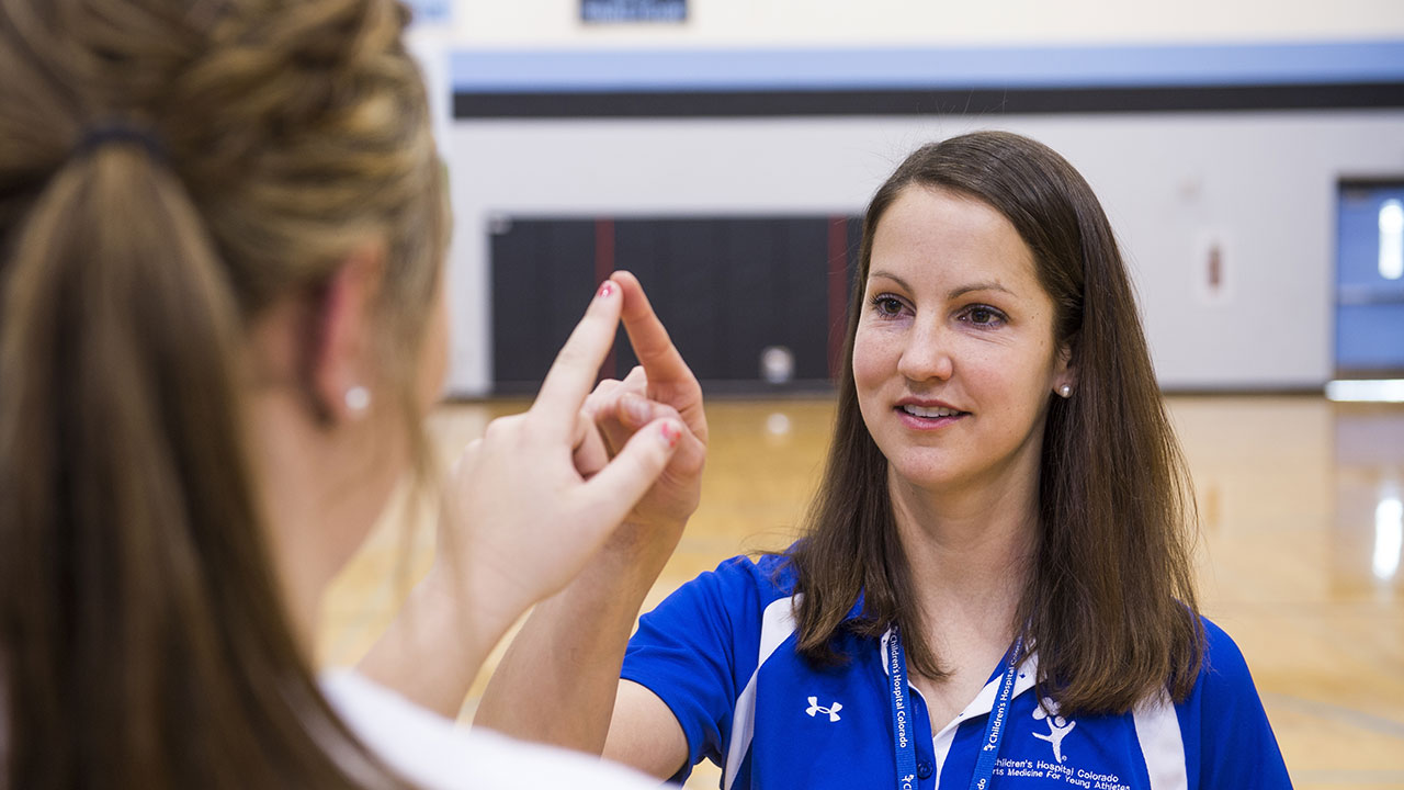Katherine Dahab, MD, performs a concussion test.