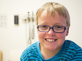 child in doctor's office smiling