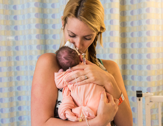 Mother with baby in NICU