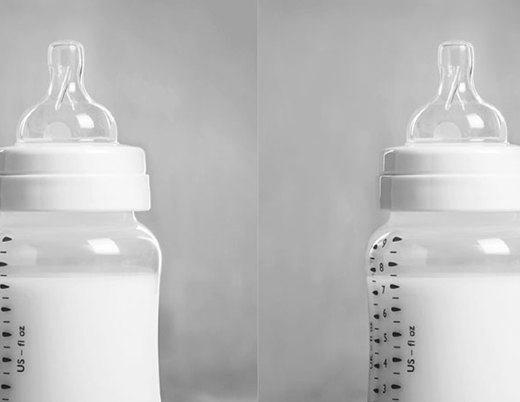 Two bottles of milk in baby bottles.